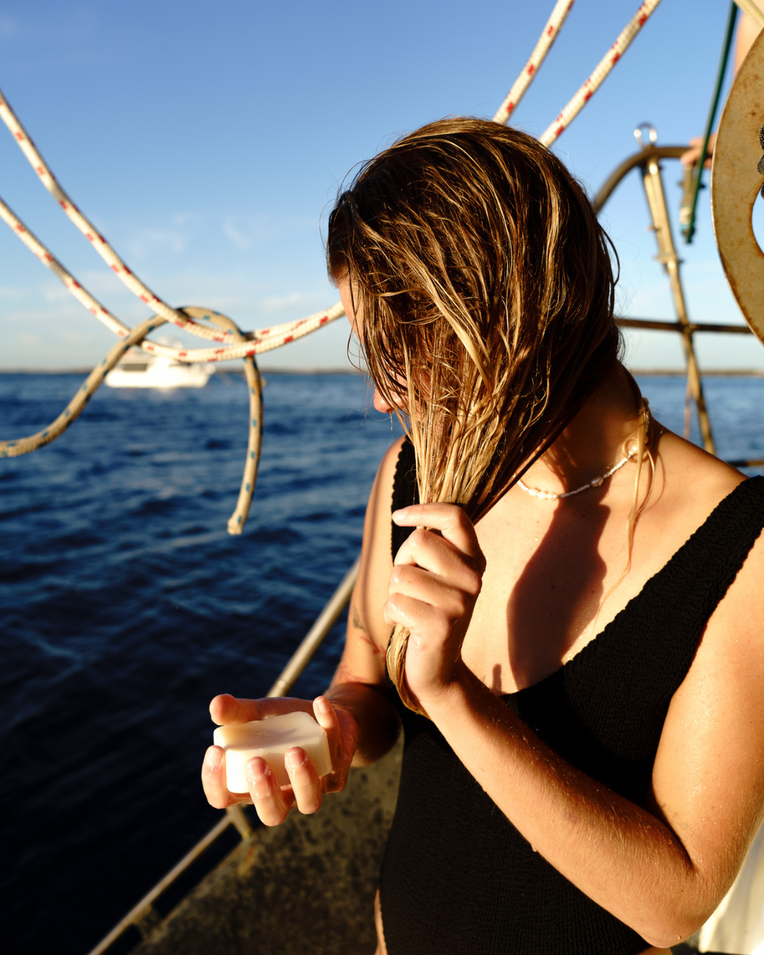Young woman with Wash Bloc on a boat