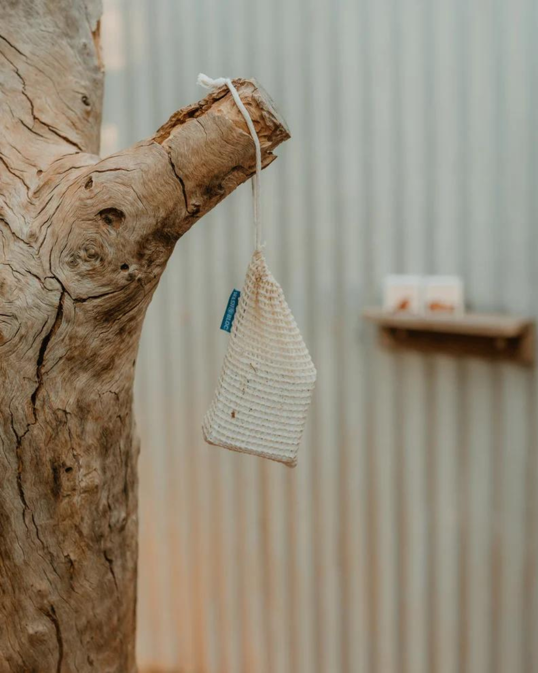 Wash Bloc & Saver Bag hanging from a tree